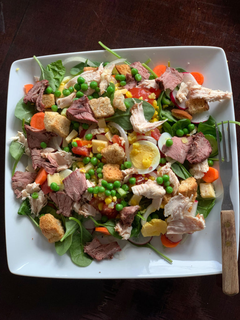 salad made with smoked steak, smoked chicken, and vegetables 