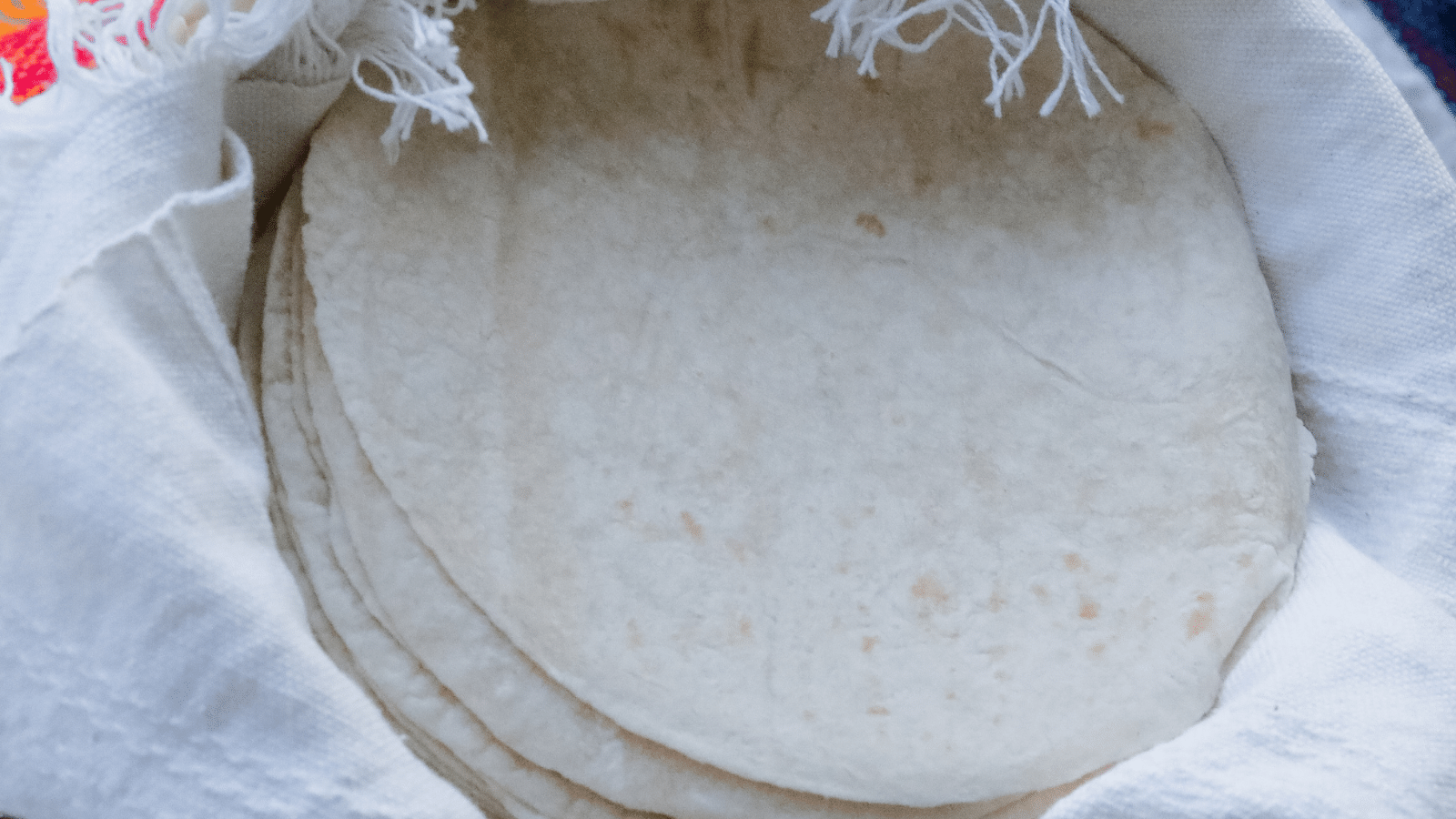 How to store sourdough tortillas while making them to allow them to become pliable.