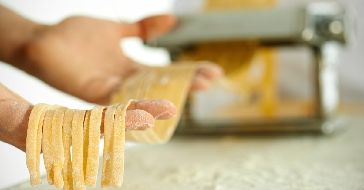 Pasta machines cut homemade egg noodles precisely.